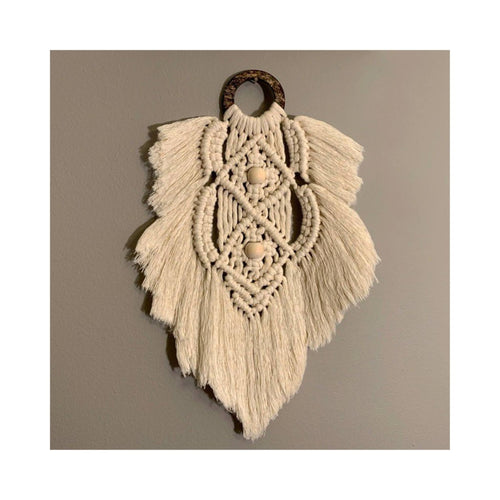 Nightingale is a beautiful macrame feather that’s the perfect accent for your wall. The ring has a gorgeous unique look as it’s made from coconut shell. You can mix and match any of the feathers or request them to be made in a variety of colors.