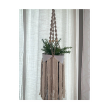 Load image into Gallery viewer, Macrame fringed plant hanger with multi colored fringe and a few accent beads.
